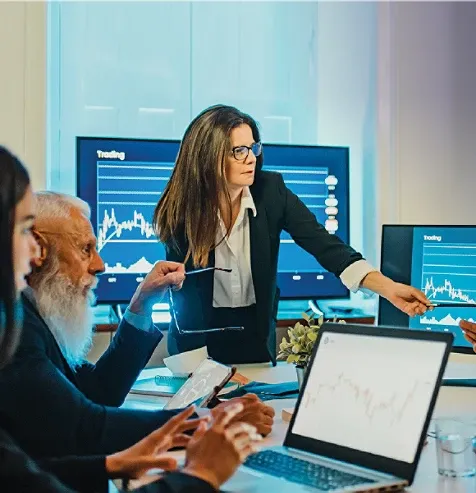Several employees in a room brainstorming