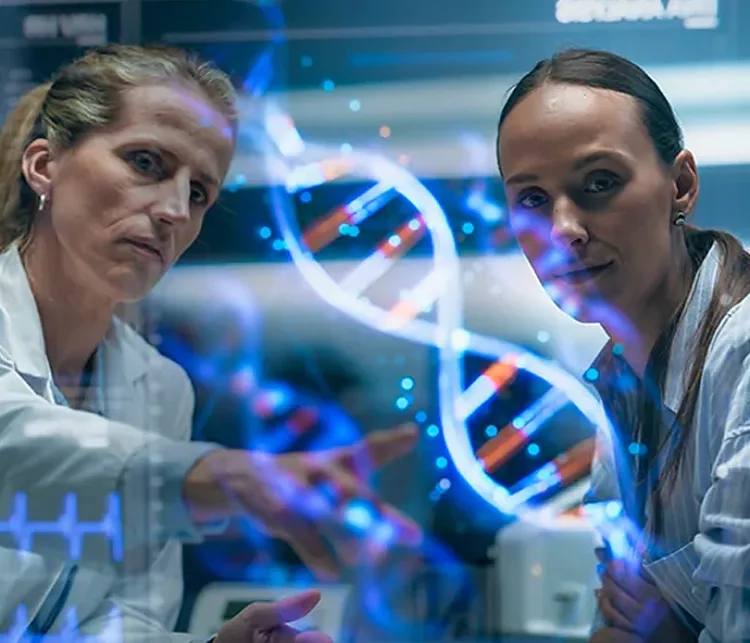 Two healthcare professionals looking at a projection of a DNA on a screen in a lab