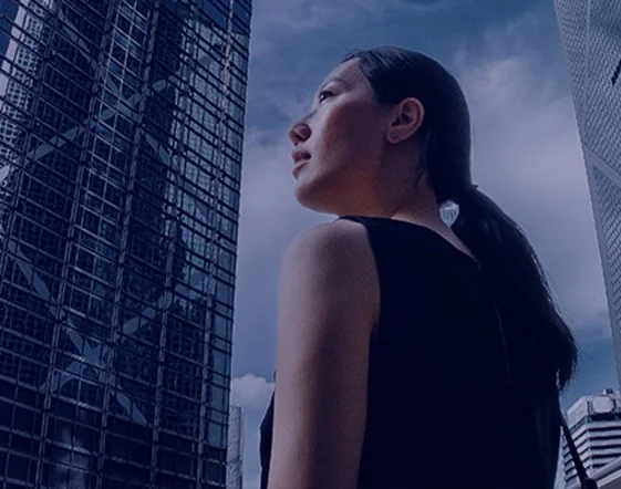 A woman looking at skycrapers