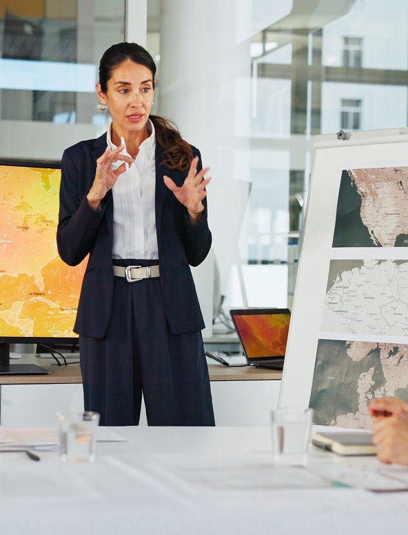 A woman holding pen in his hands explaining