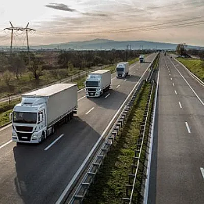 View of a row of semi truck on the road.