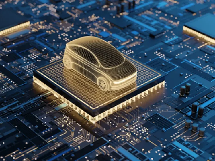 A golden computerized car sitting on top of a computer chip.