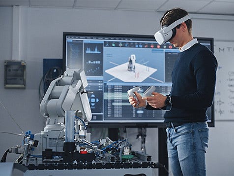 A person working, wearing VR glasses