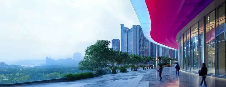 City view from the front of a building that has a colorful awning