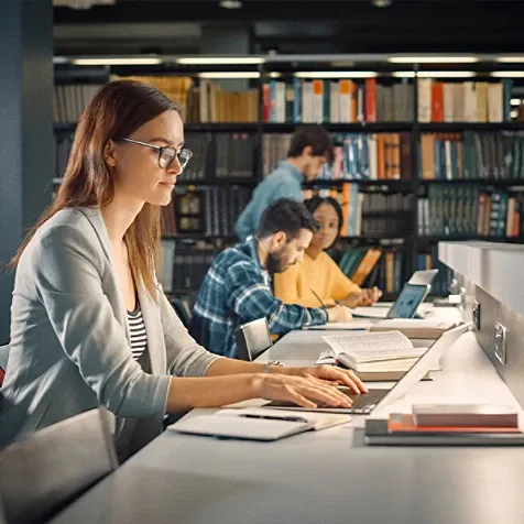 People working in a library.
