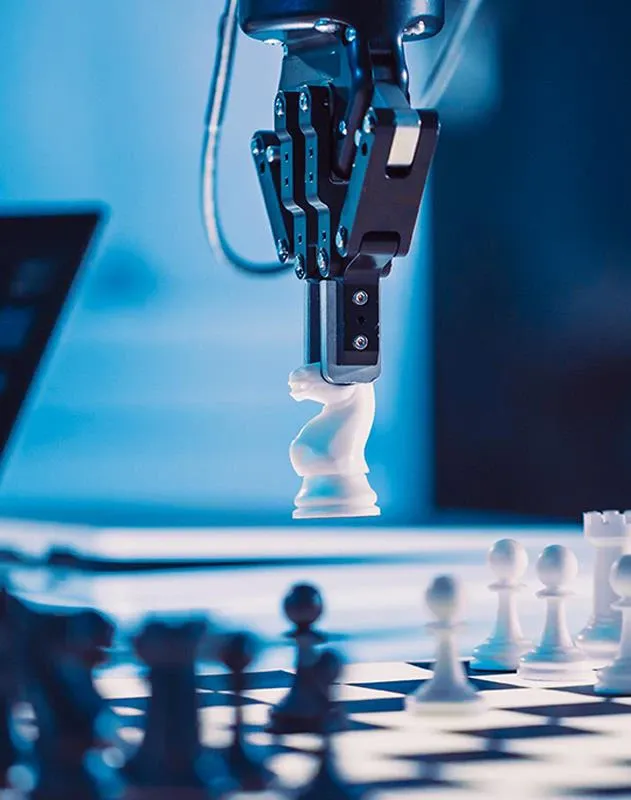 A robotic arm playing chess.