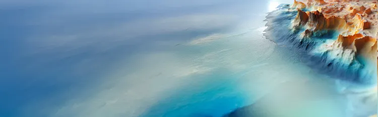 aerial view of a rocked ocean shore in thick fog