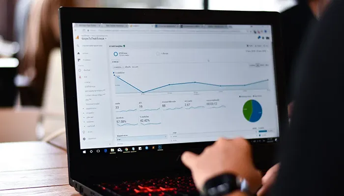 Laptop displaying a graph of finance report