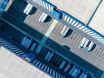Aerial view of a manufacturing parking lot of semi trucks.