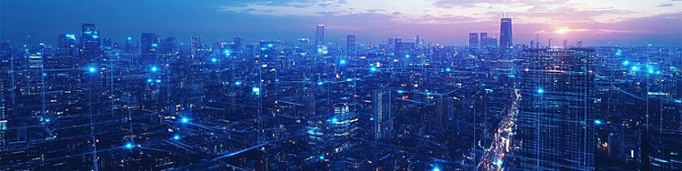 Cityscape against a blue evening sky