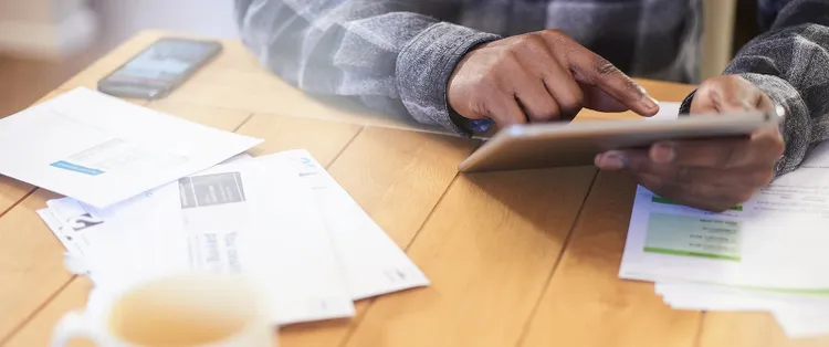 Man browsing his tablet