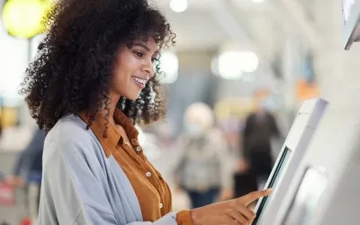 A female touching a digital display