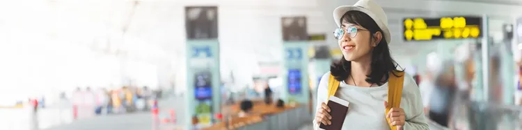 A traveller holding a passport