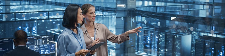 Two colleagues having a discussion in an office environment