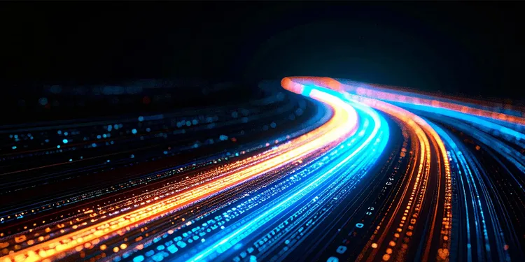 series of glowing lights stretching along a dark road, enhancing the nighttime scenery with their warm illumination.