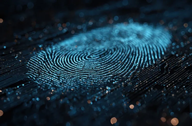 A close-up of a fingerprint displayed prominently against a solid black background.