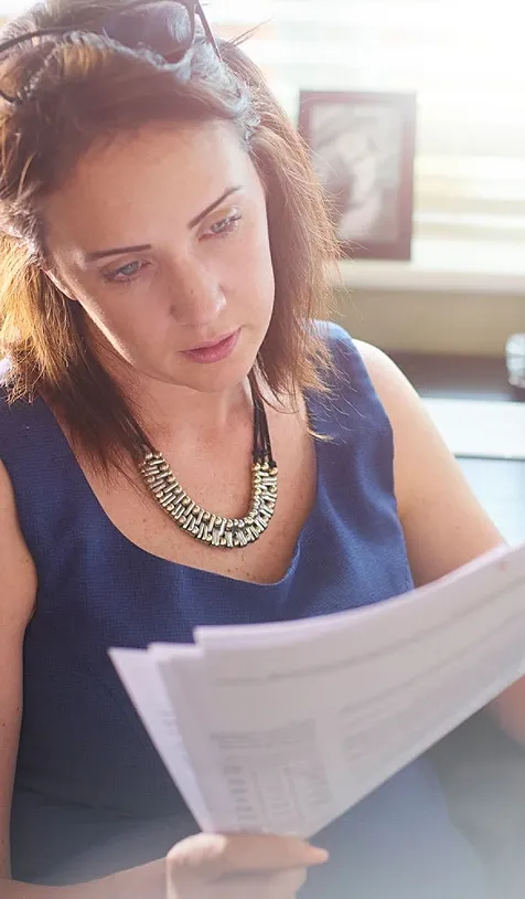 A woman looking at papers