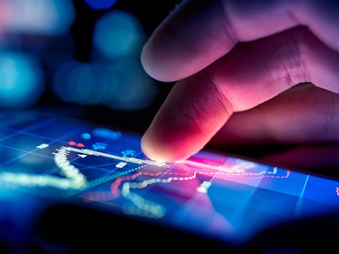 A closeup view of fingers on a digital screen