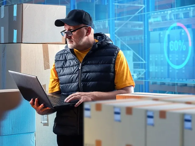 A man holding laptop