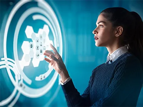 Young woman studying a diagram on a digital screen