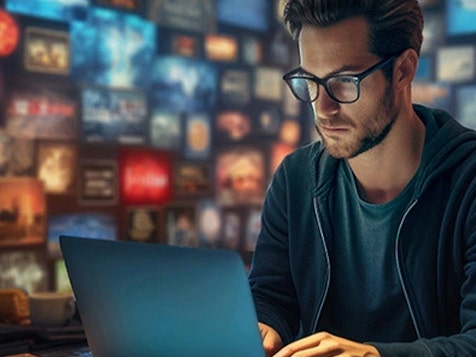 Entrepreneur focused on laptop in a broadcast studio