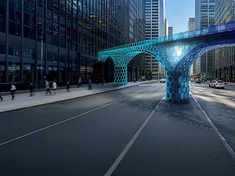 Glowing teal hexagonal structure on a city street.