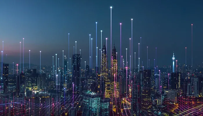 A city sky view with illuminated commnication graphics