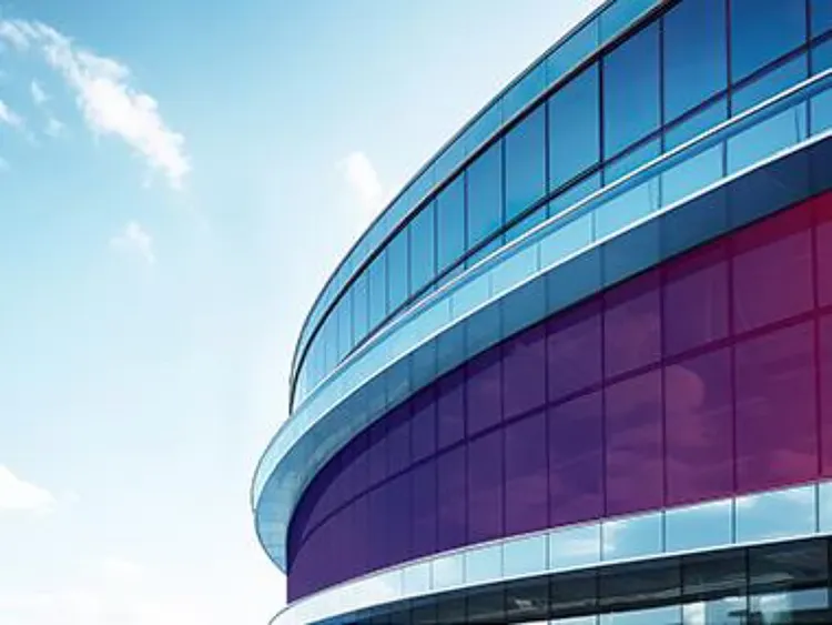 A modern building with curved glass architecture